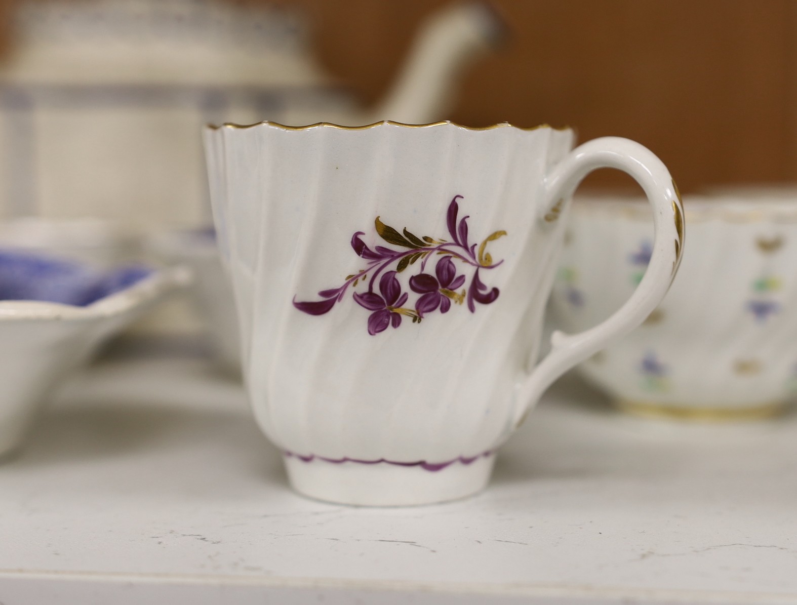 A selection of 18th century and later English porcelain tea bowls, a pair of Spode pickle dishes, and a teapot, 15cm tall